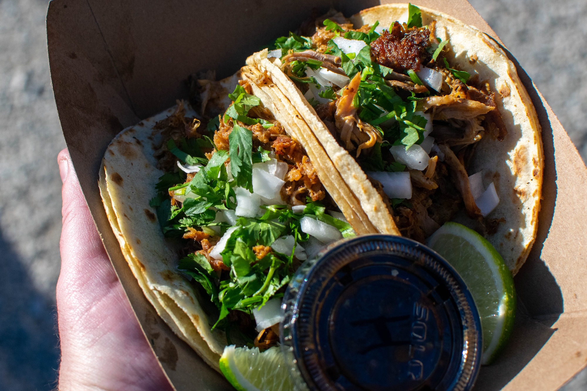 RVA Taco Festival 2026 - Close-up of tacos topped with cilantro, onion, and lime wedges